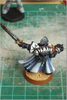 The back of the black templar Commander by Black suit