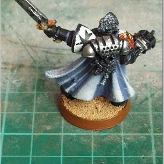 The back of the black templar Commander by Black suit