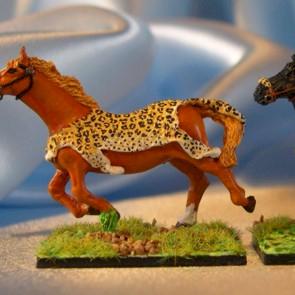 Horses with leopard skin saddles by strontygirl