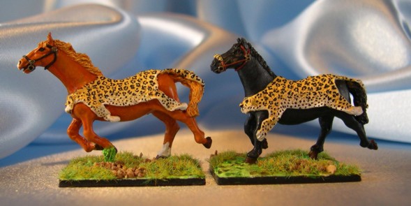 Horses with leopard skin saddles by strontygirl